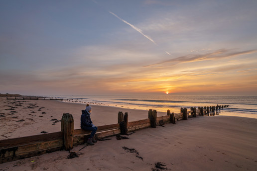  a group of people on a beach